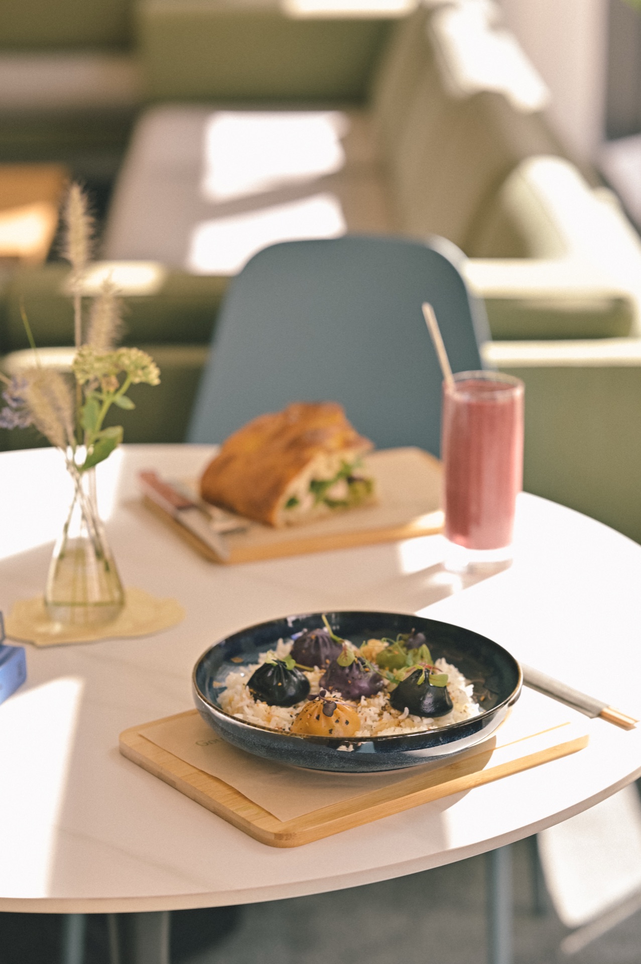 Cafe table with dim sum and smoothie