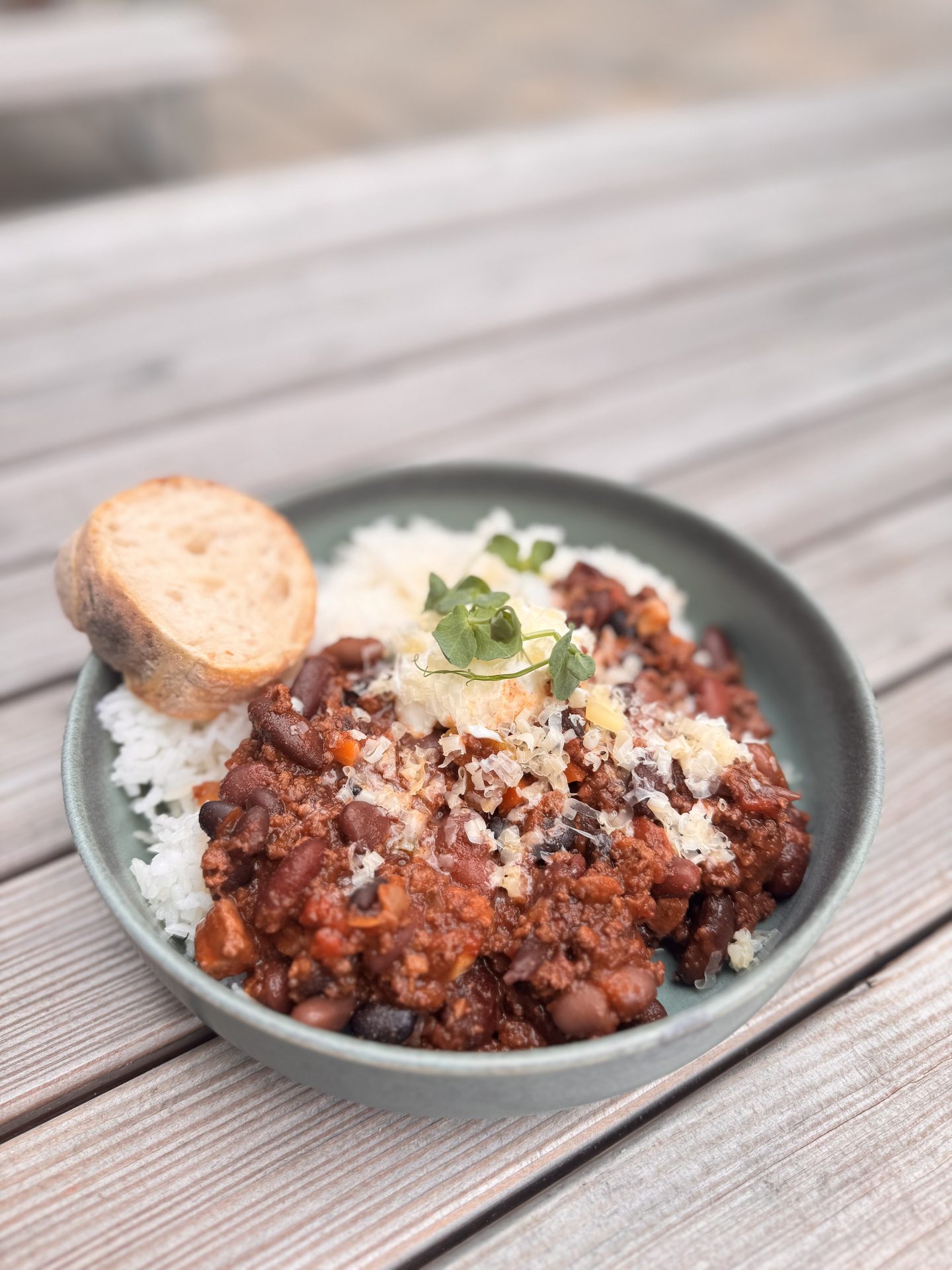 Chili con carne with rice and bread